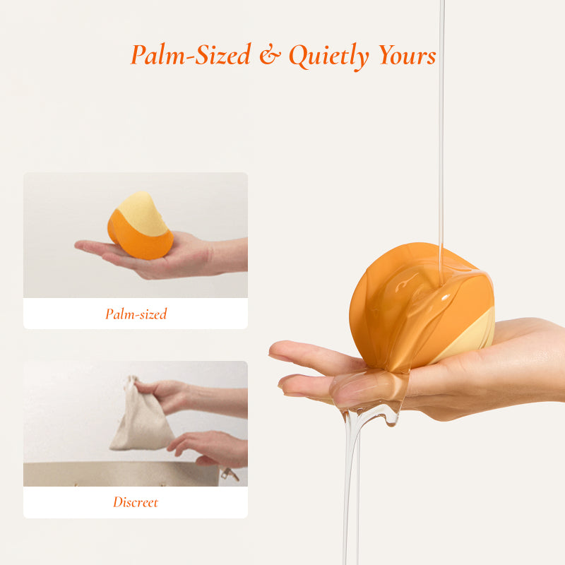 Osuga Tiltap compact clitoral vibrator displayed in the palm of a hand