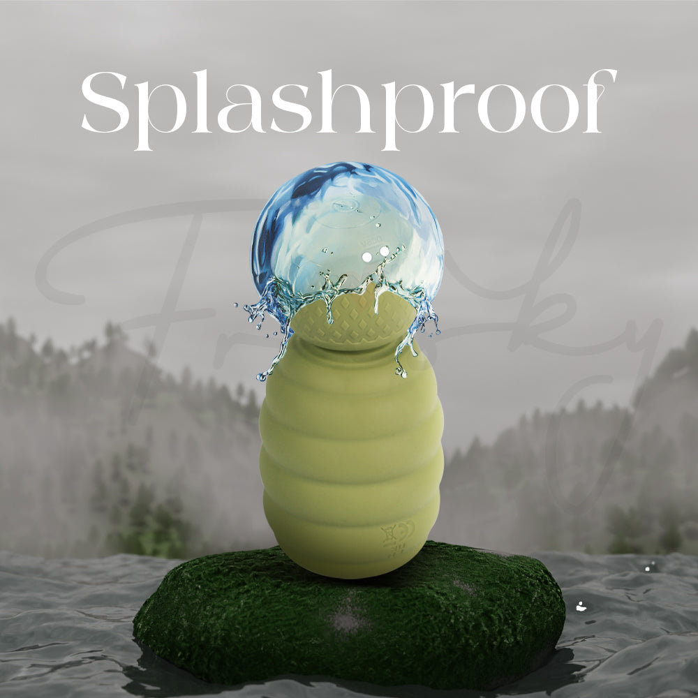 Green massager outdoors with water splash showing splashproof and water-resistant design