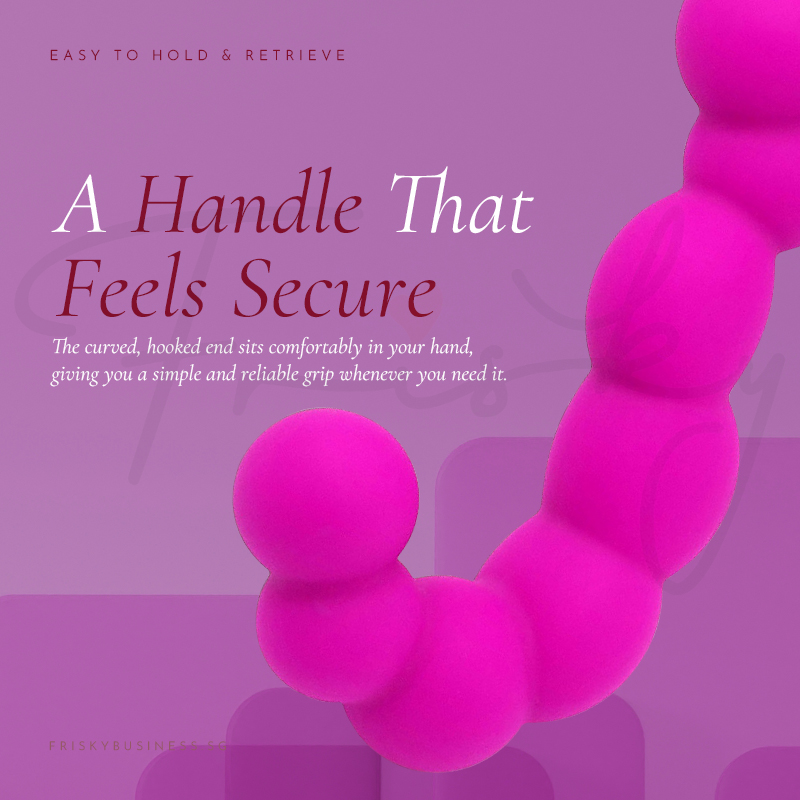 Close-up of the curved handle against a purple background