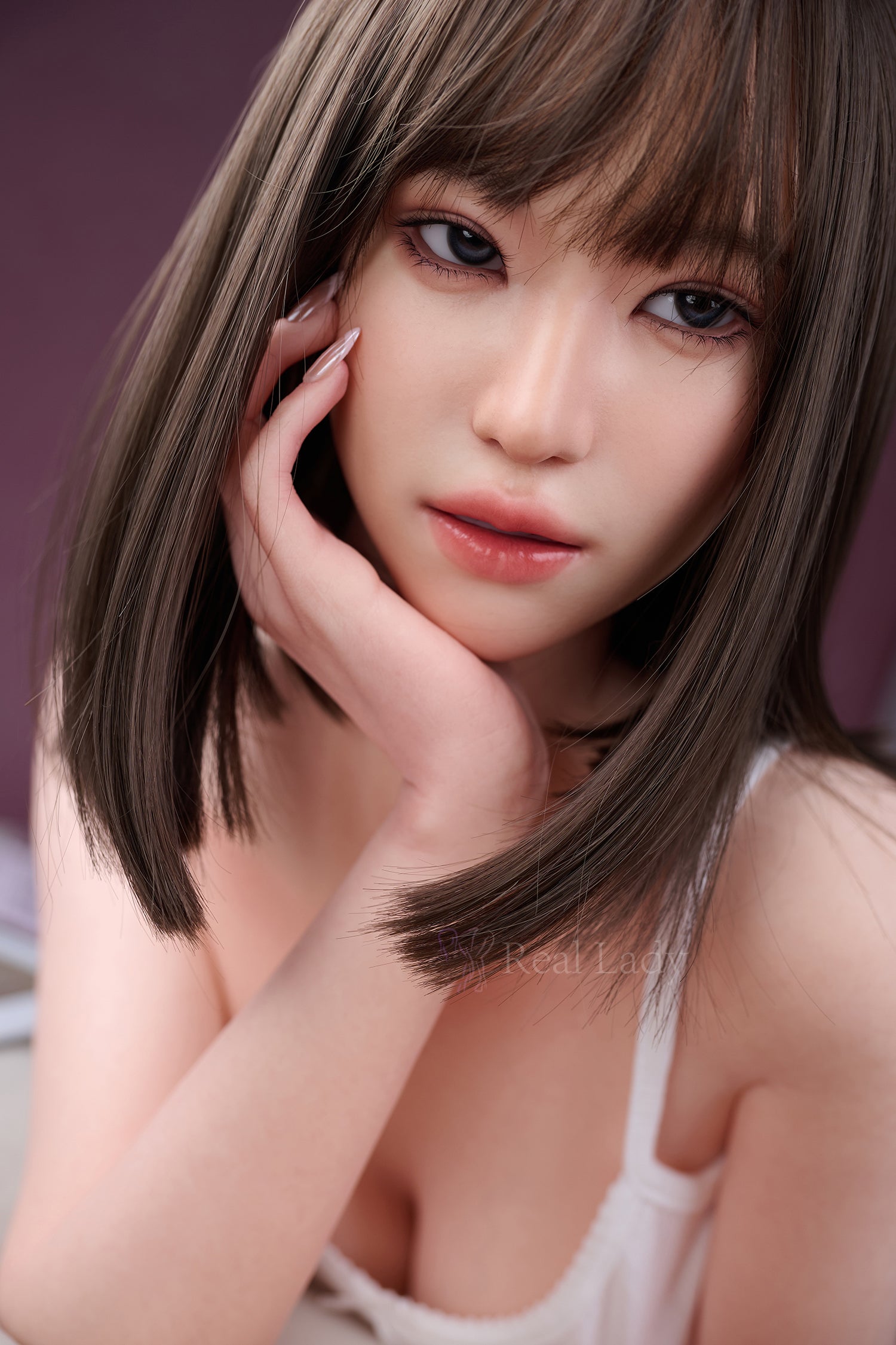 RealLady 150 cm E Pink Lover Series Silicone - Viki with shoulder-length hair posing with hand near face against a purple background