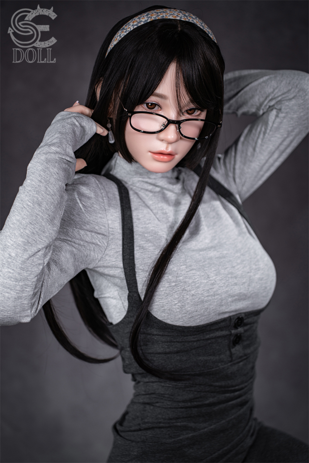 Realistic SEDOLL T153 cm A Aya Series Silicone - Hinata.A with black hair and glasses wearing a gray top and black overalls.