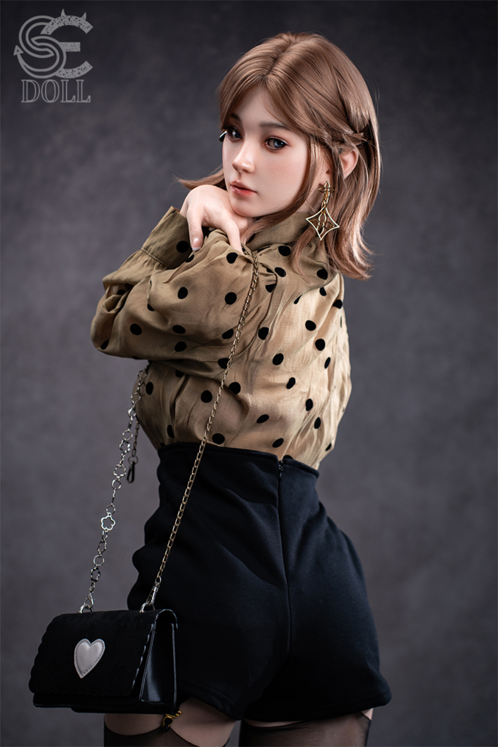 SEDOLL T153 cm A Aya Series Silicone - Miori.C wearing a polka dot blouse and black skirt with a black handbag featuring a heart design.