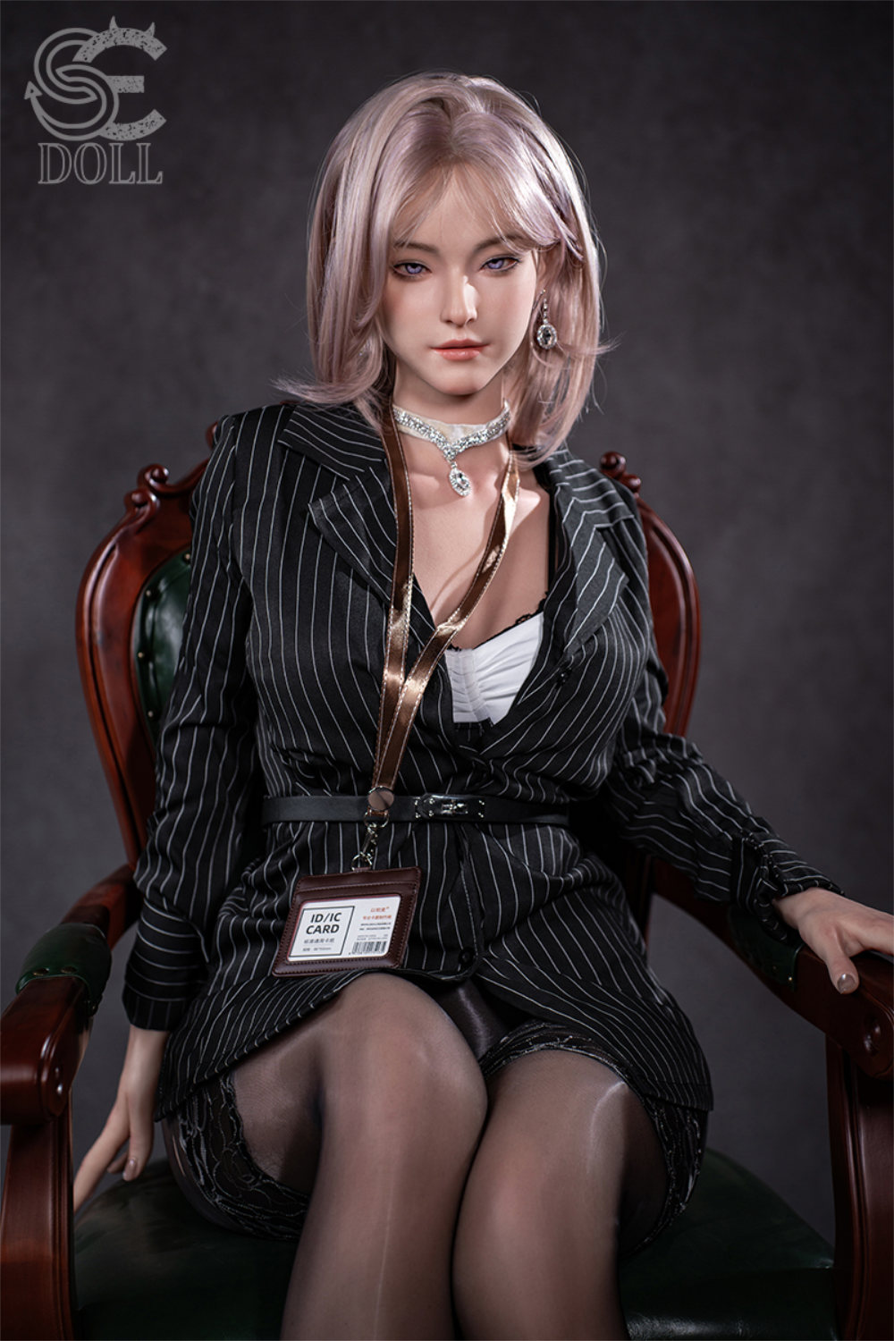 SEDOLL T160 cm C Aya Series Silicone - Shion.B sitting in a wooden chair wearing a striped attire.