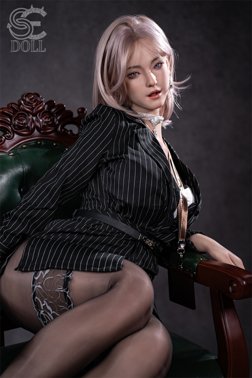 SEDOLL T160 cm C Aya Series Silicone - Shion.B sitting in a wooden chair with green leather, wearing an office outfit.