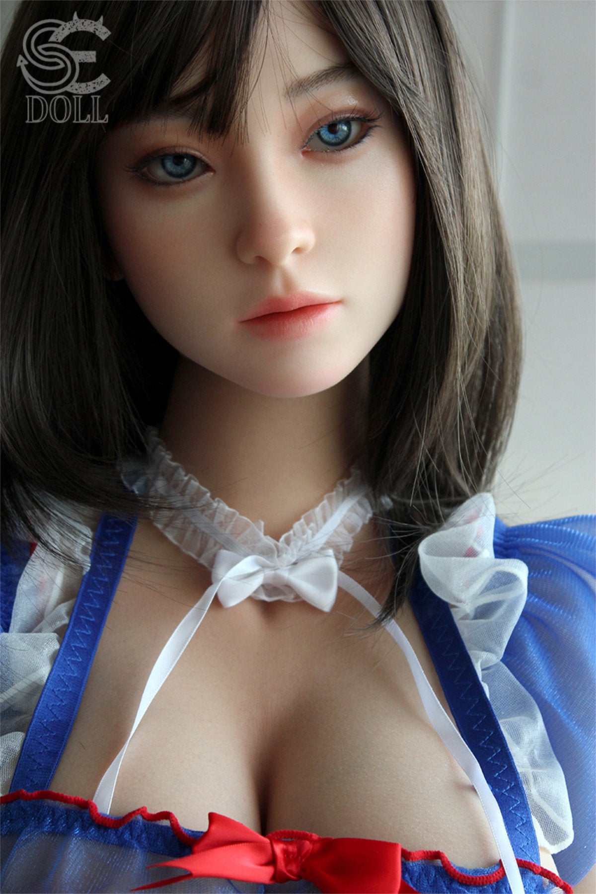 SEDOLL T161cm C Aya Series Silicone - Miori.C – Close-up pose in a blue floral-print robe left open at the chest, dark straight-bang hairstyle, softly lit backdrop with subtle warm tones.