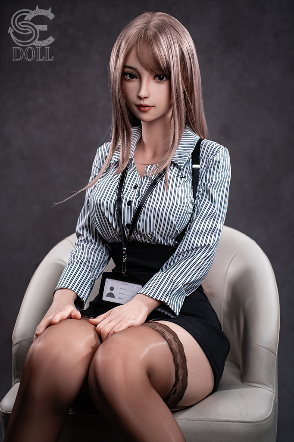 SEDOLL T161 cm C Aya Series Silicone - Yuuki.K with blonde hair and a striped shirt sitting on a chair.