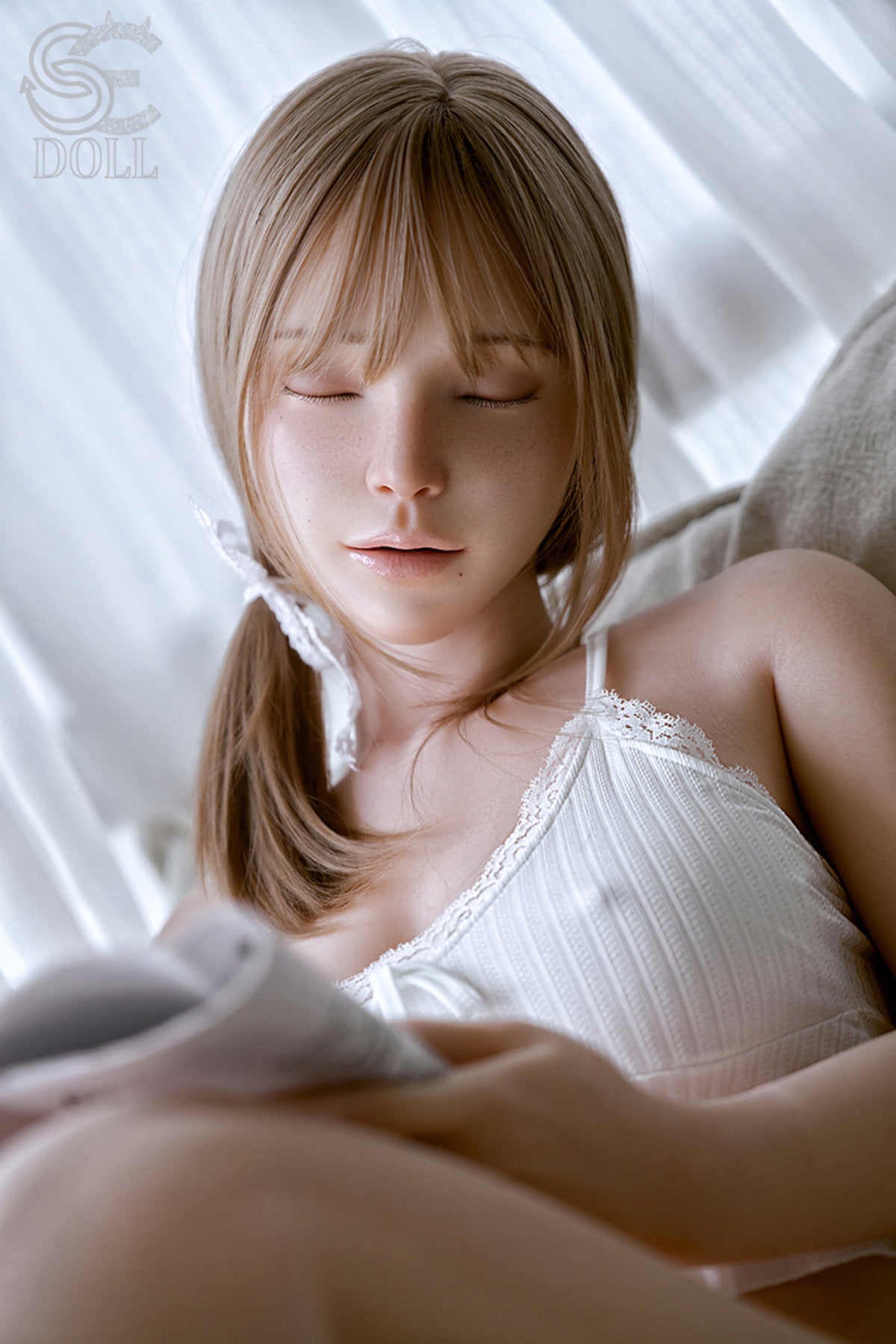 SEDOLL T163 cm C Silicone Pro - Jenny reclining on a white bed with eyes closed, white knit tank top, soft dreamy light filtering through sheer curtains