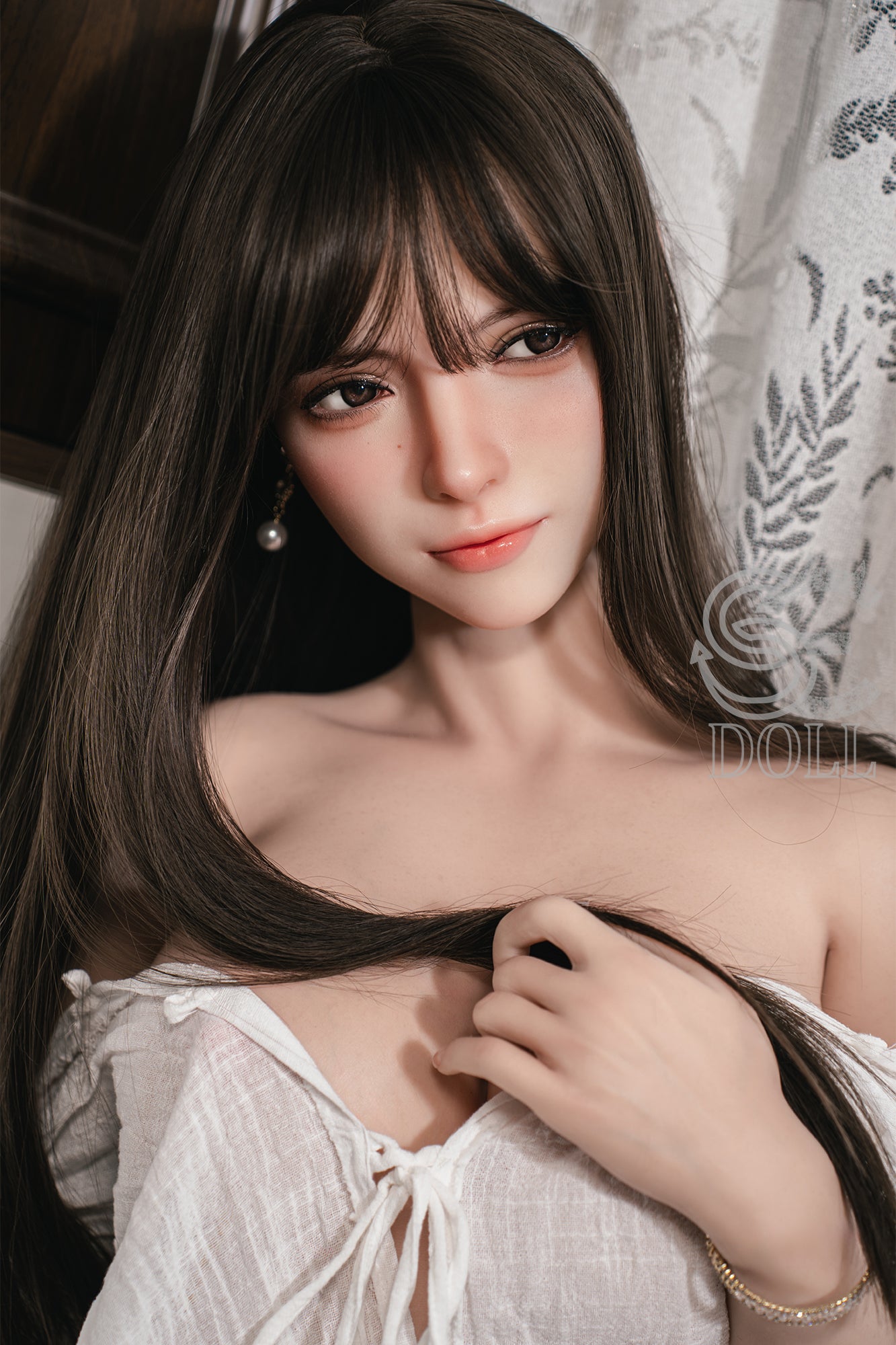 SEDOLL T165 cm C Silicone Pro - Annika.J with long dark hair wearing a white top, holding their hair.
