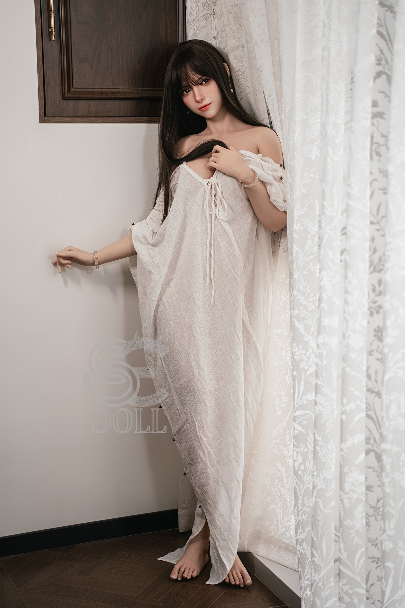 SEDOLL T165 cm C Silicone Pro - Annika.J in a white lace nightgown standing in a room with curtains.
