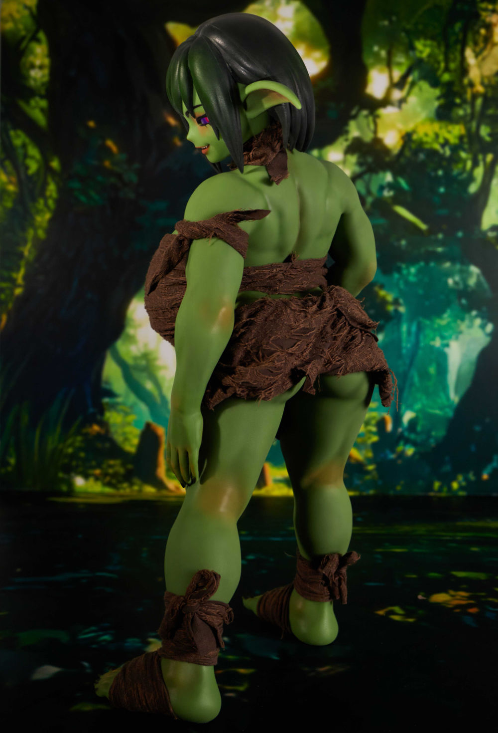 Close-up of fantasy doll’s hip and thigh, green skin