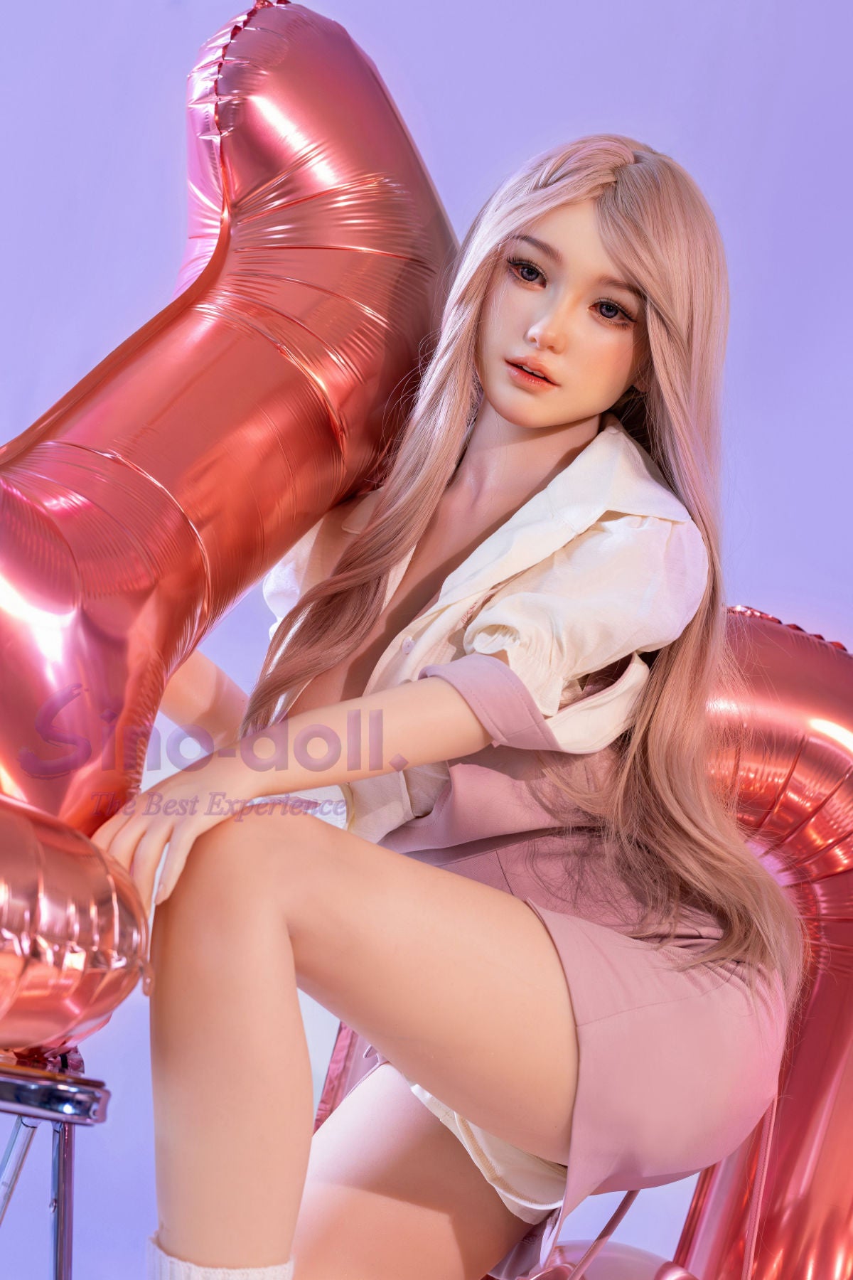 Sino Doll Pro Soft Max 161 cm Platinum Silicone - Linchun (R+S Effect) with long blonde hair and a white outfit, surrounded by pink balloons.