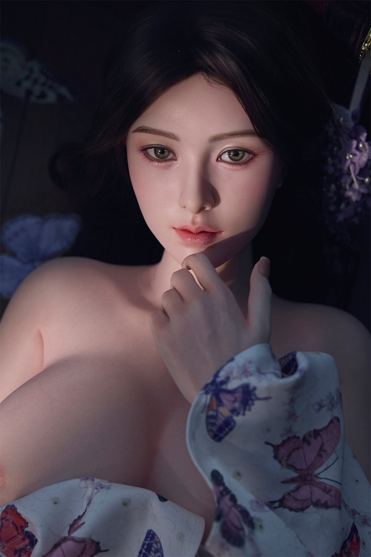 Starpery 171cm D - Xue V3 – Seated pose, floral kimono-style robe open, dark wavy hair down, dark backdrop.