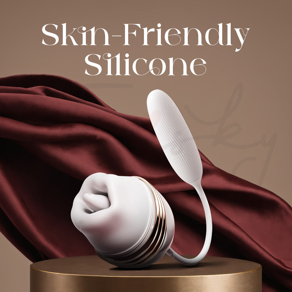 Soft body-safe silicone vibrator displayed on elegant satin fabric background