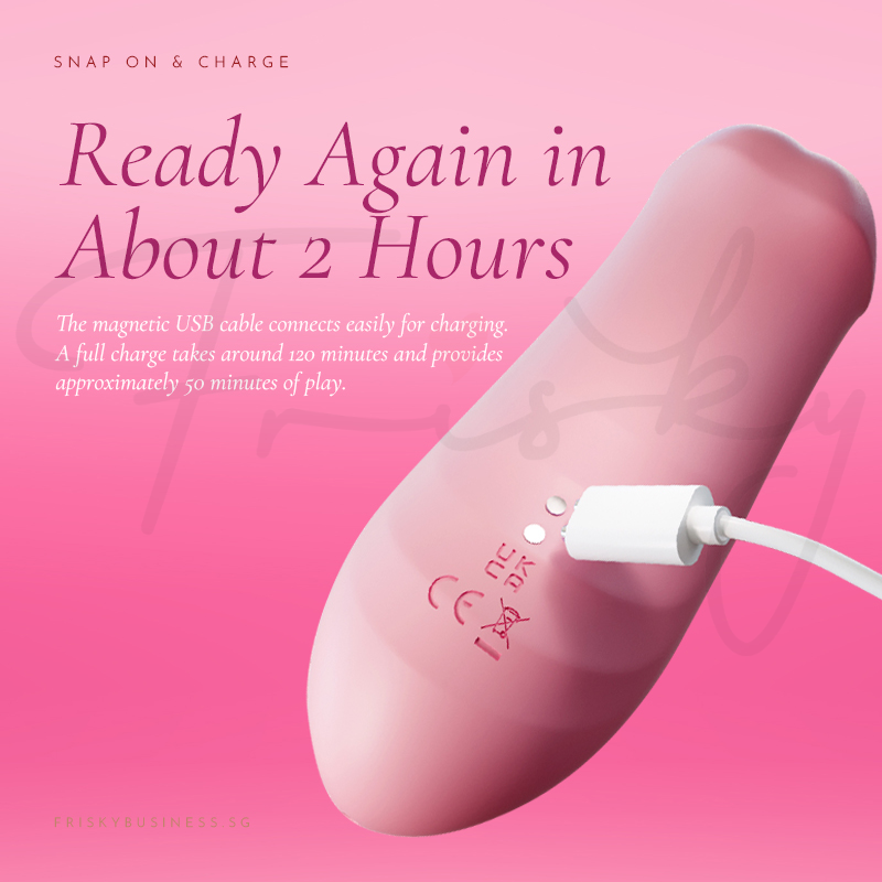 Stimulator shown with its charging cable on a pink background
