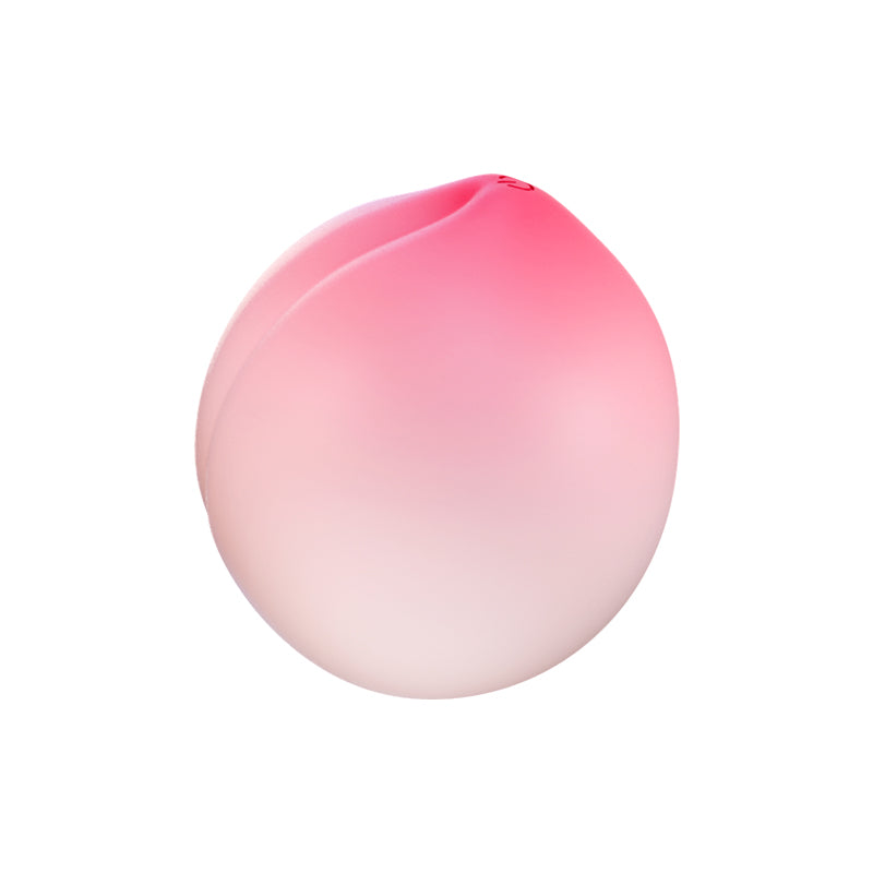 Peach-shaped suction stimulator in pink and coral ombre with a soft cleft top