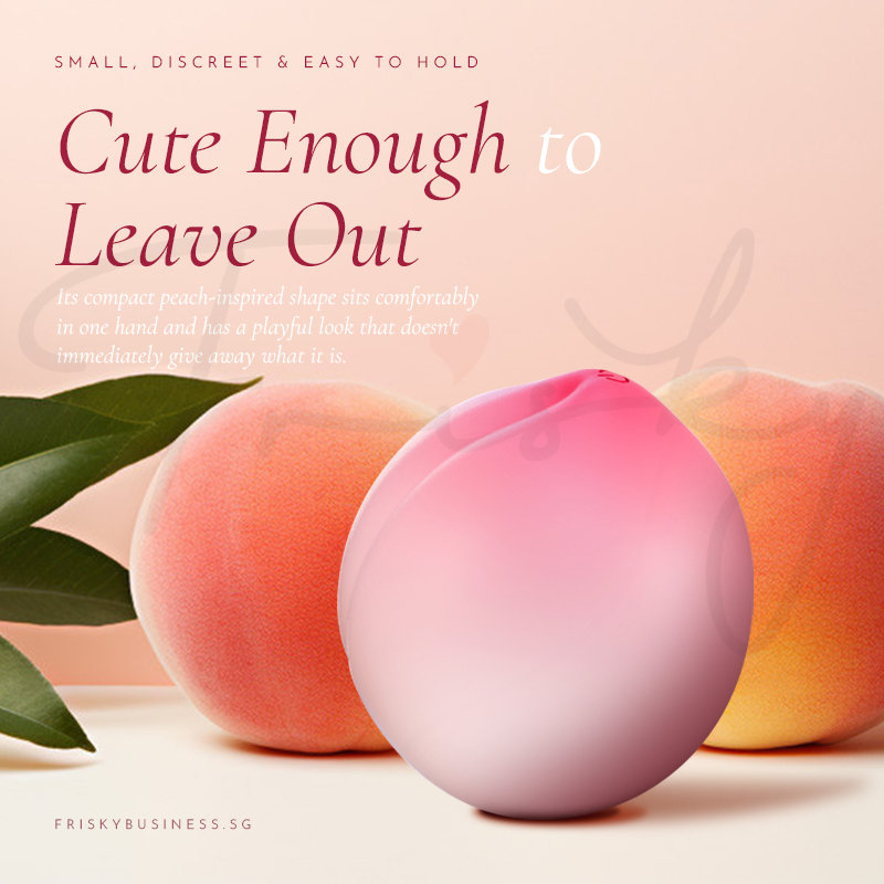 Stimulator shown beside real peaches on a soft pink background