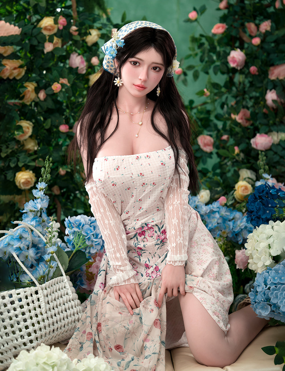 TOP-CYDOLL 167cm D-Cup Una Realistic Sex Doll in a floral dress posing among flowers and greenery