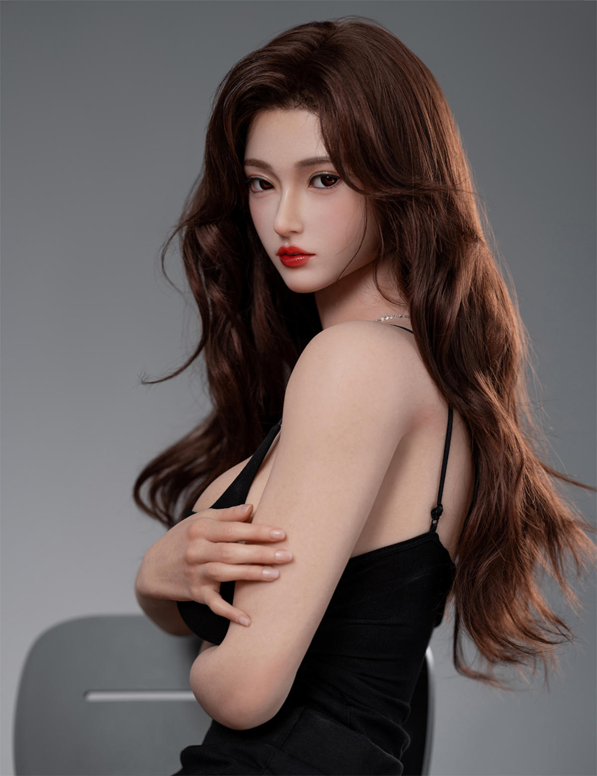 TOP-CYDOLL 168cm F-Cup Rinka Realistic Sex Doll close-up with arms crossed beneath her bust, black dress cut low, side-angle pose