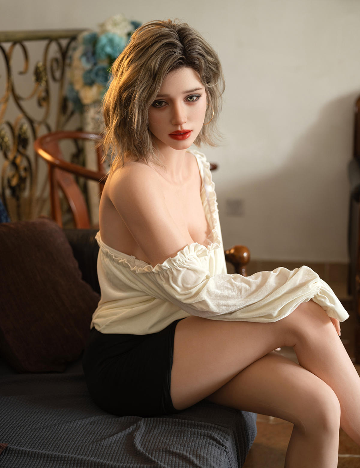 TOP-CYDOLL 168cm F-Cup Sofia Realistic Sex Doll in a white lace top and black shorts sitting on a couch.