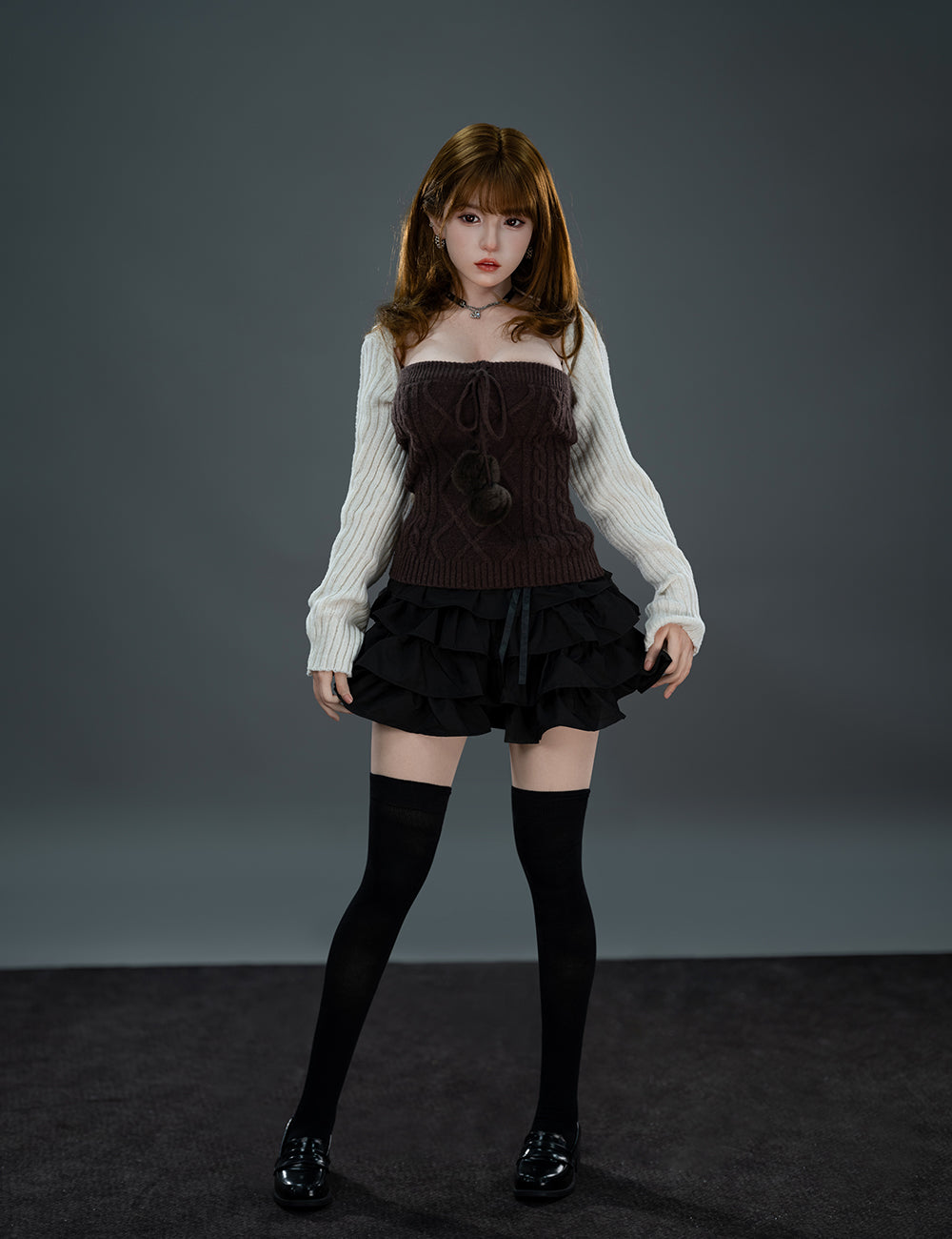 TOP-CYDOLL 157cm D-Cup Liang Realistic Sex Doll wearing a dark outfit with a white sweater against a gray background