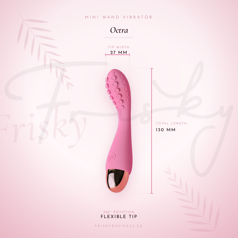 Octra vibrator shown against a pink background with size markings