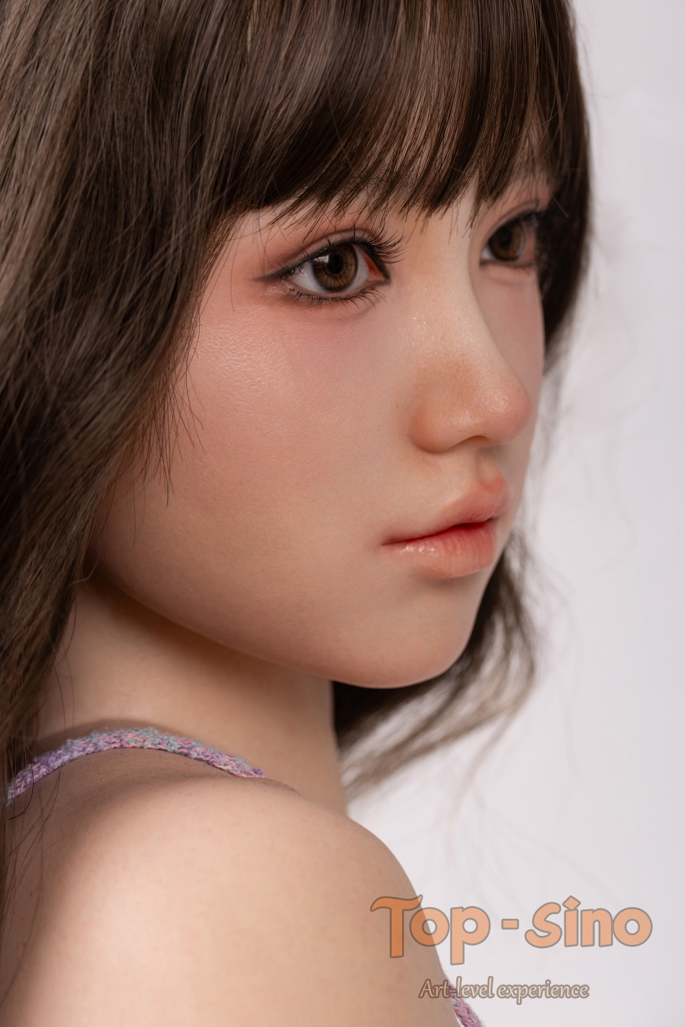 Top Sino 167 cm Platinum Silicone - Mitang (RRS+) close up face with long hair and a neutral expression.