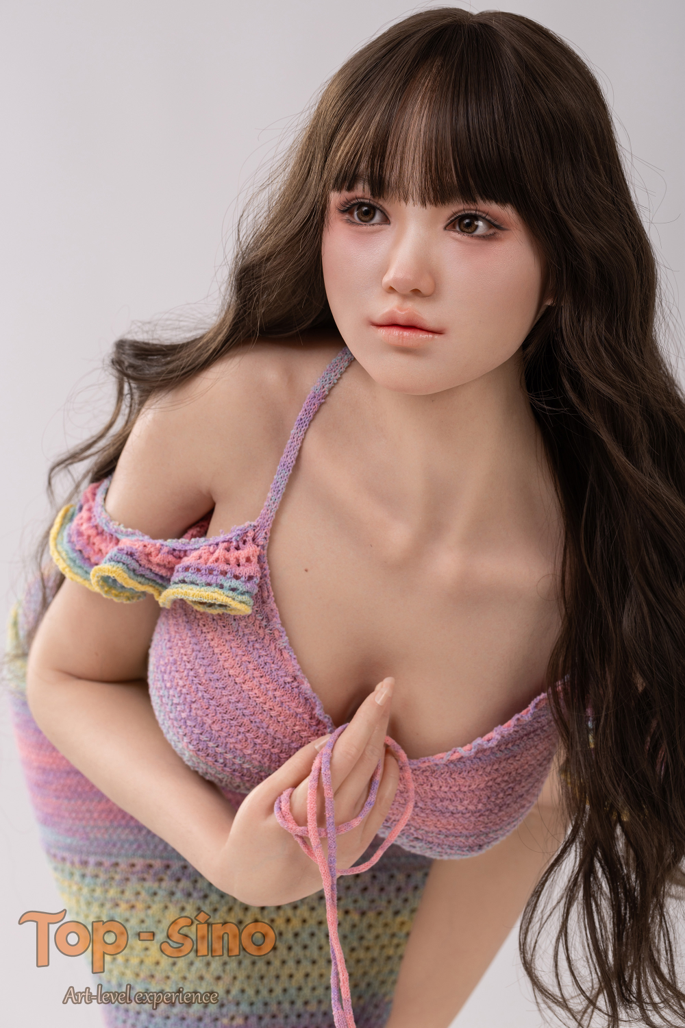 Top Sino 167 cm Platinum Silicone - Mitang (RRS+) wearing a colorful knitted outfit.