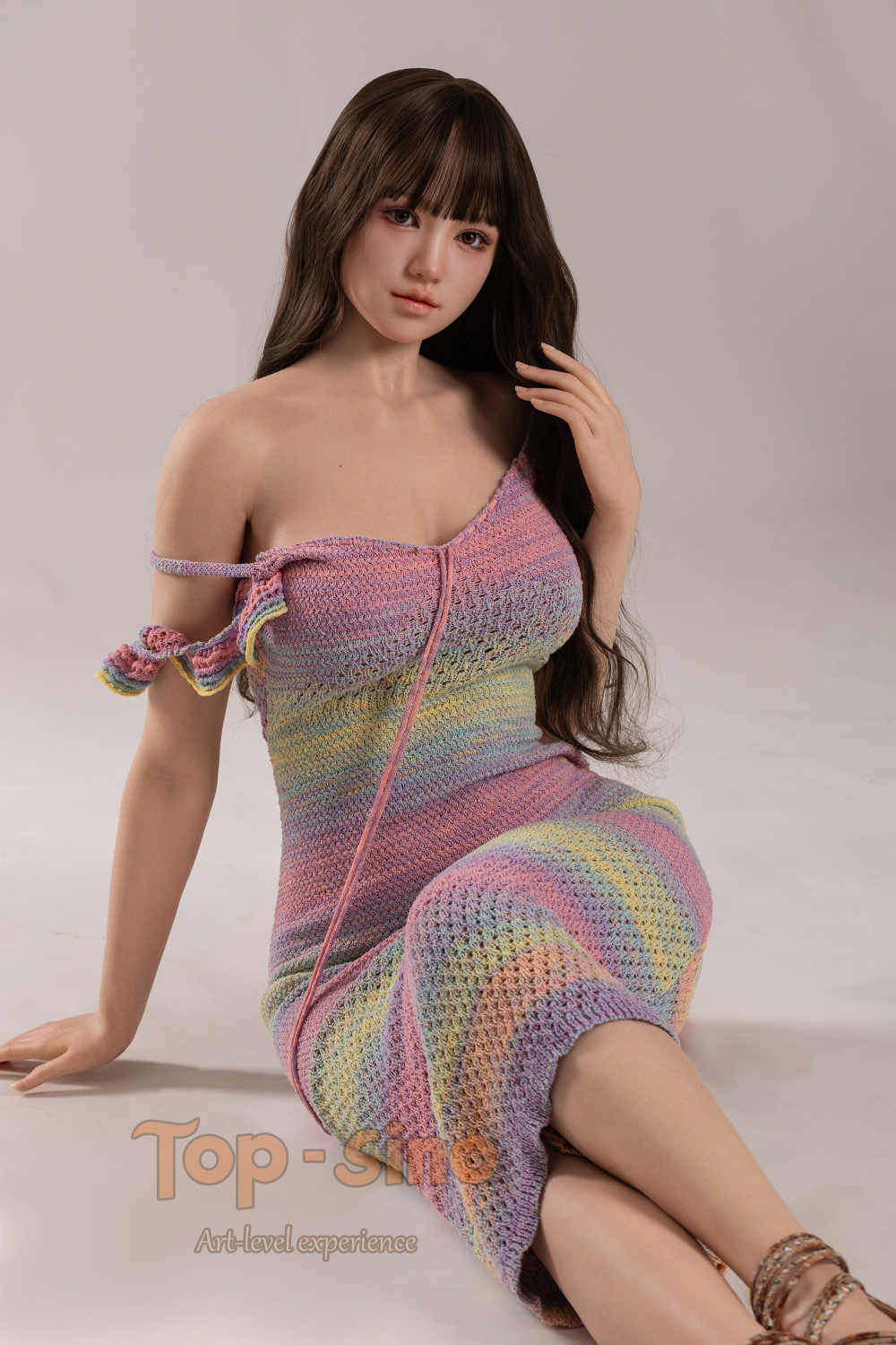 Top Sino 167 cm Platinum Silicone - Mitang (RRS+) wearing a colorful crochet dress while sitting on the floor.