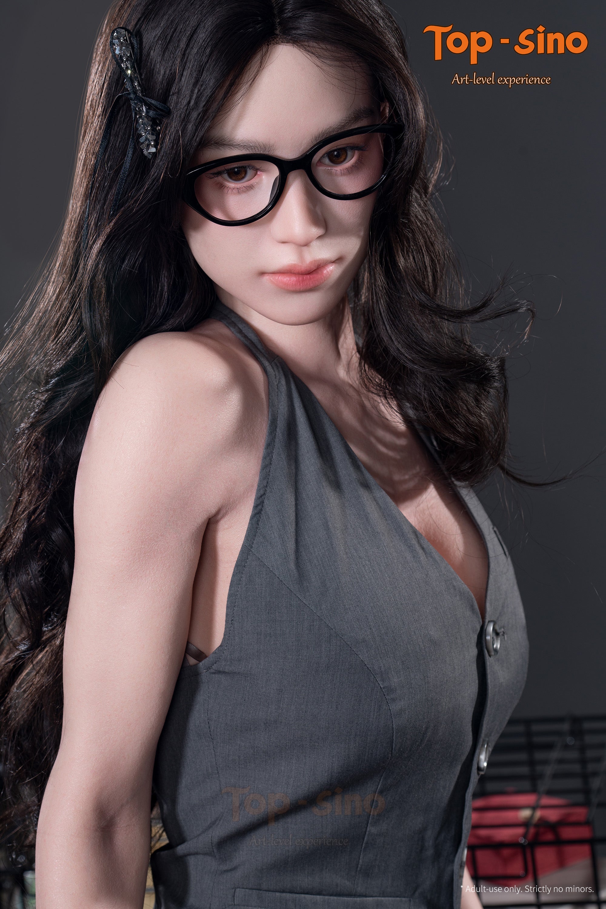 Top Sino T165 cm Platinum Silicone  Recreated Series - Miyun (RRS+) wearing glasses and a gray dress showing her bare shoulder.