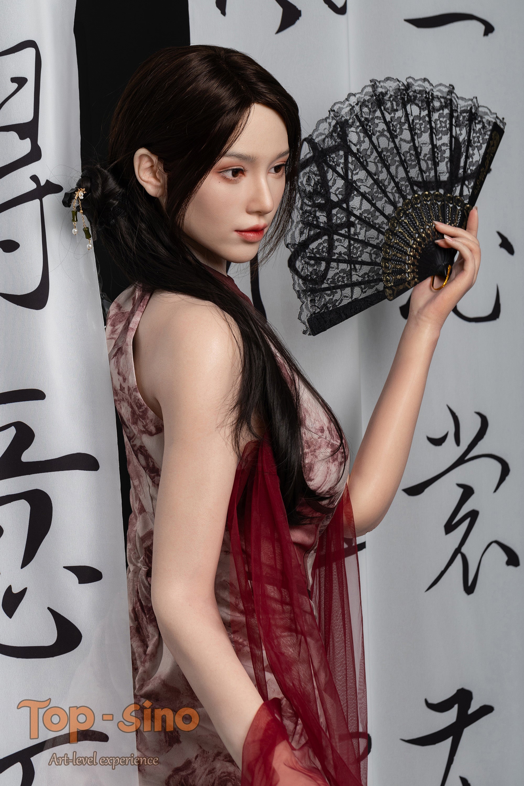 Top Sino 167 cm Platinum Silicone - Mishi (RRS+) in a sleeveless dress holding a black lace fan against a white curtain written in black text