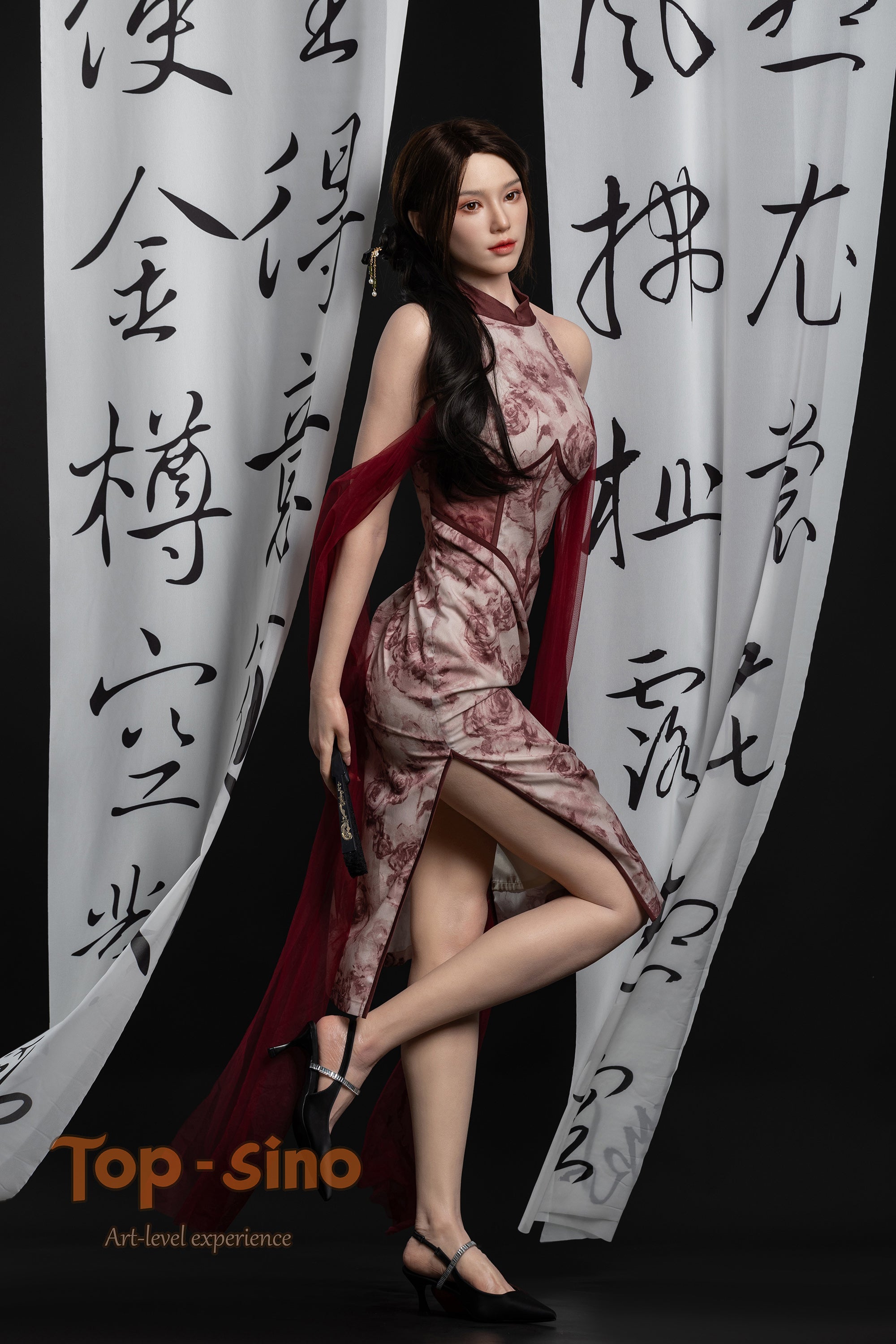 Top Sino 167 cm Platinum Silicone - Mishi (RRS+) in a red palette sexy dress standing in front of calligraphy on a white curtain.