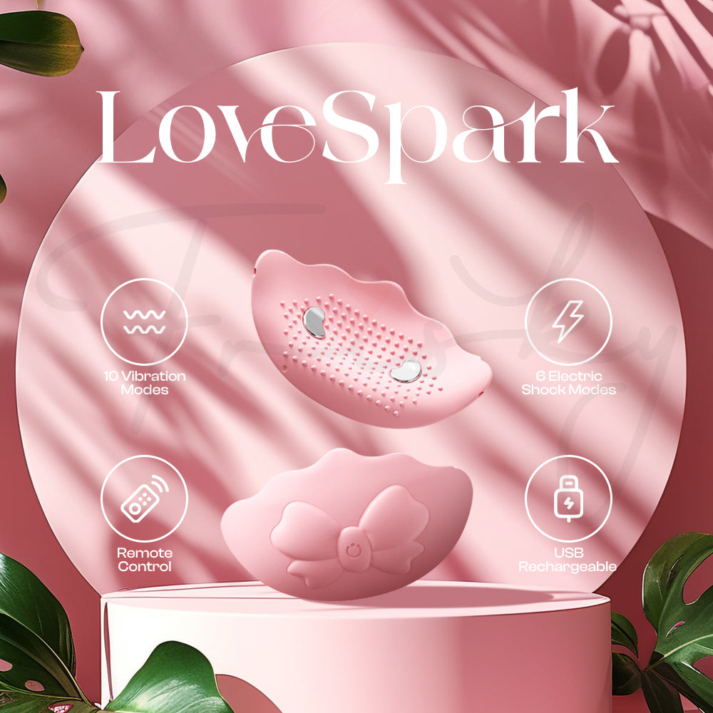 Pink wearable vibrator displayed on satin fabric with elegant soft lighting