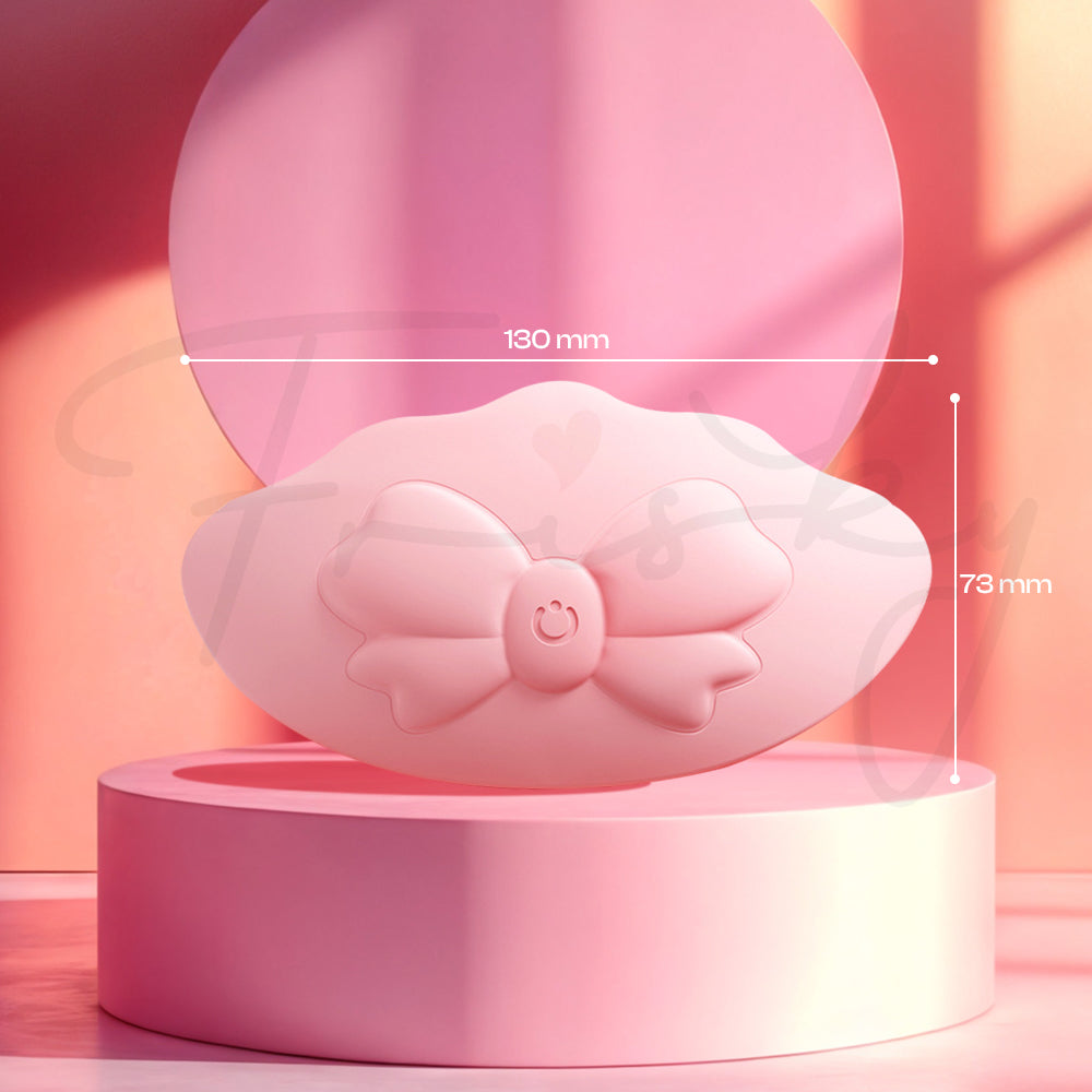 Close-up of pink vibrator showcased on minimal pedestal background