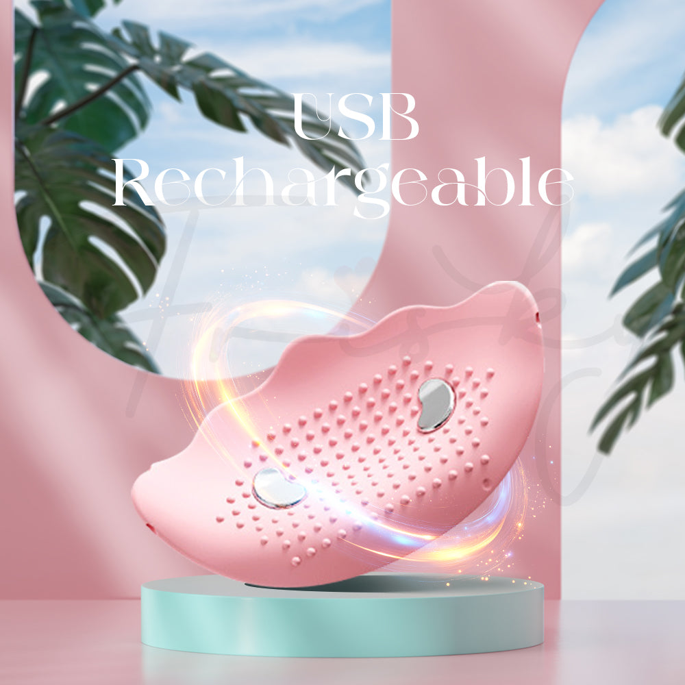 Water-resistant wearable vibrator placed near water with fresh tropical setting
