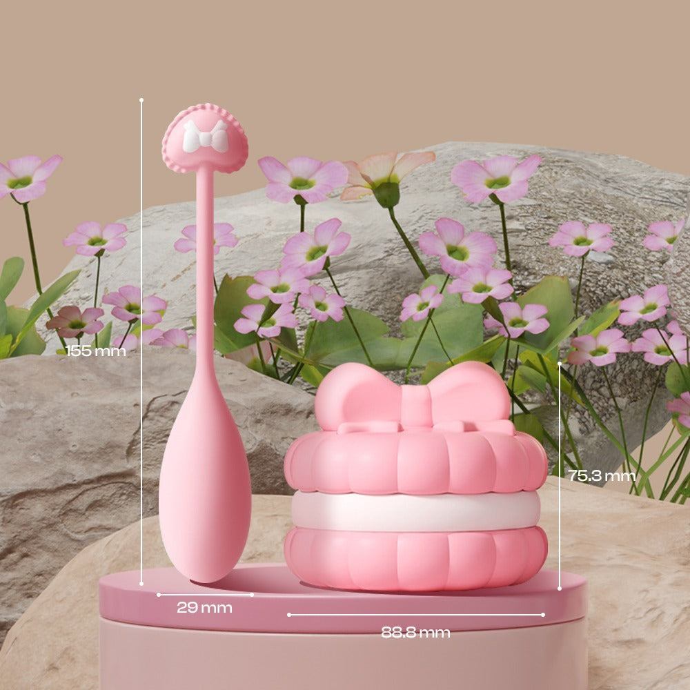 Pink skincare device with measurements on a natural background