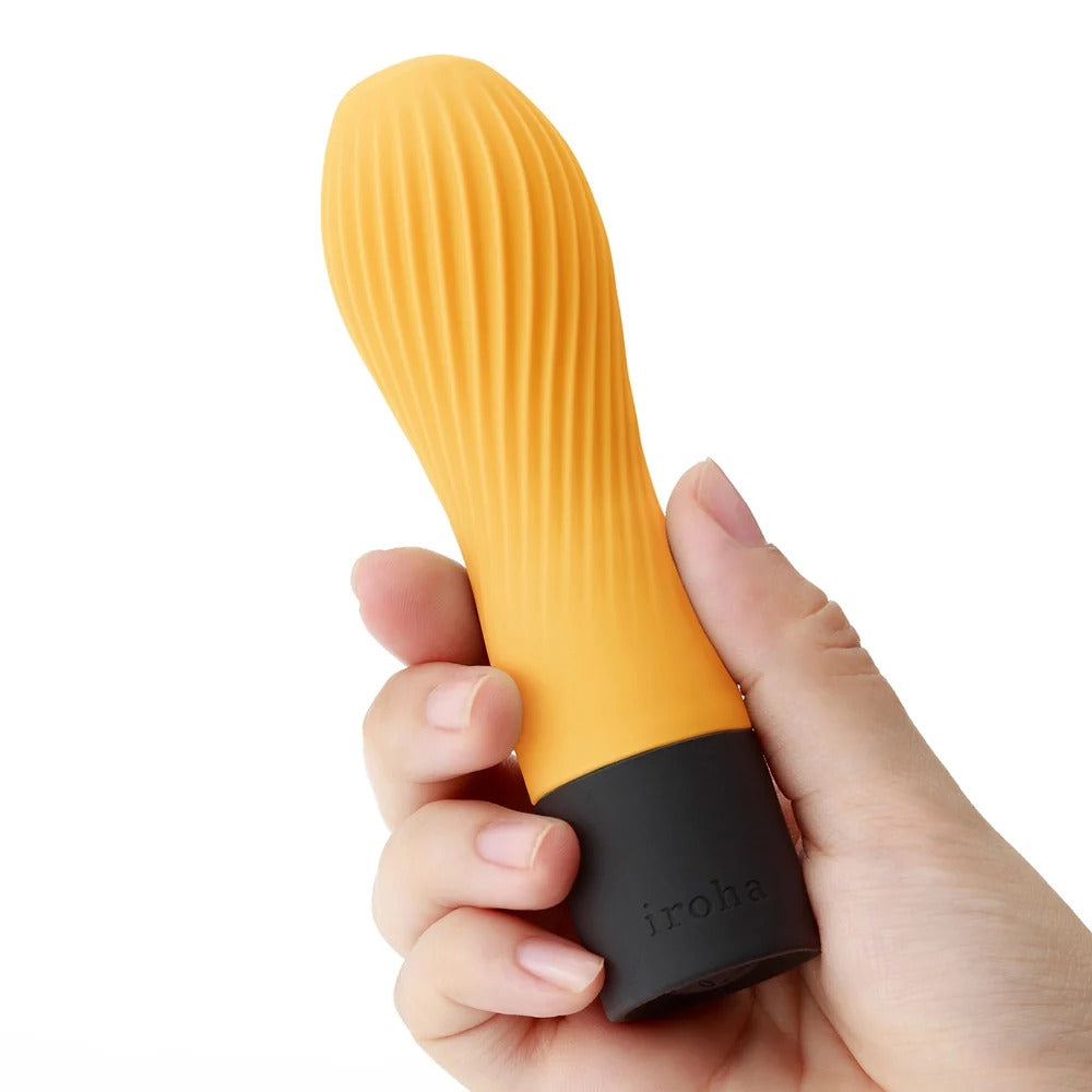 Iroha Zen Hanacha yellow massager held showing ribbed texture