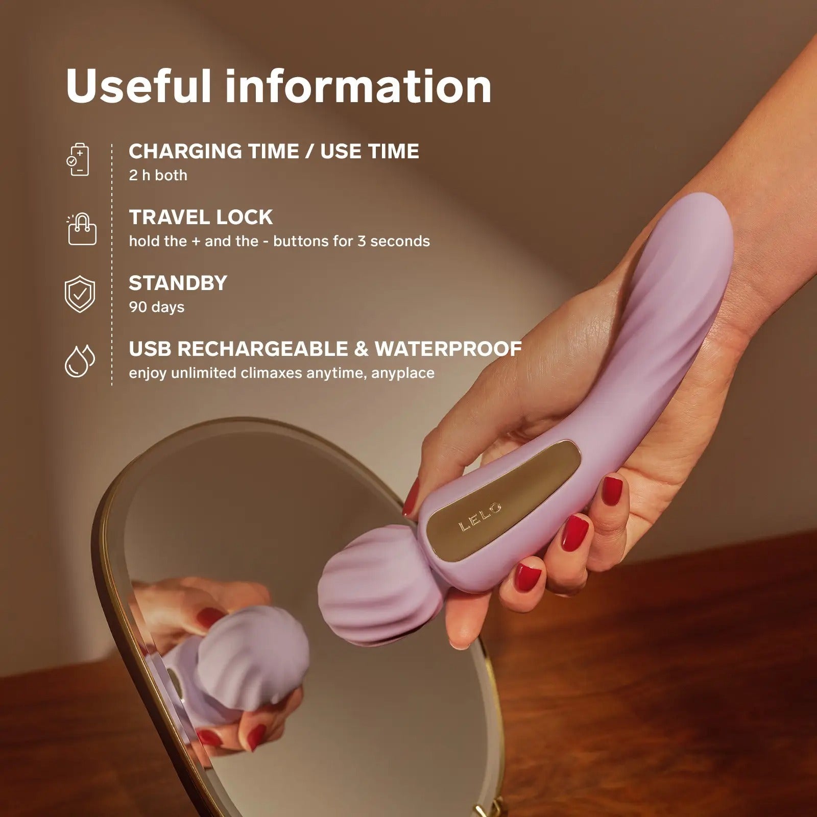 Lelo Switch soft pink wand vibrator placed on a wooden table beside accessories.