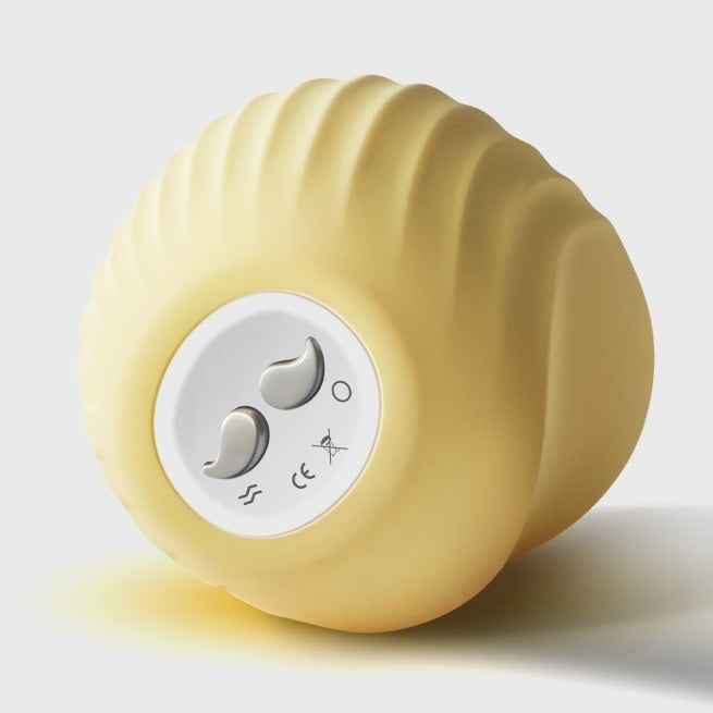 Yellow Cuddly Bird turned backward showing control buttons and curved textured design.