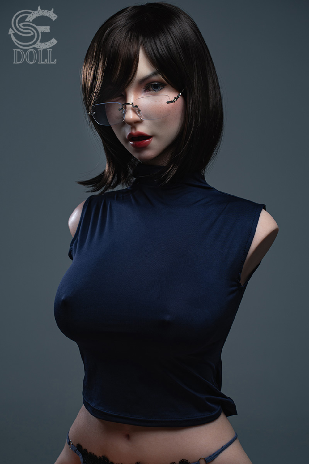 Frontal view of the Zoe Ellis silicone torso wearing a tight dark blue sleeveless turtleneck and matching lingerie.