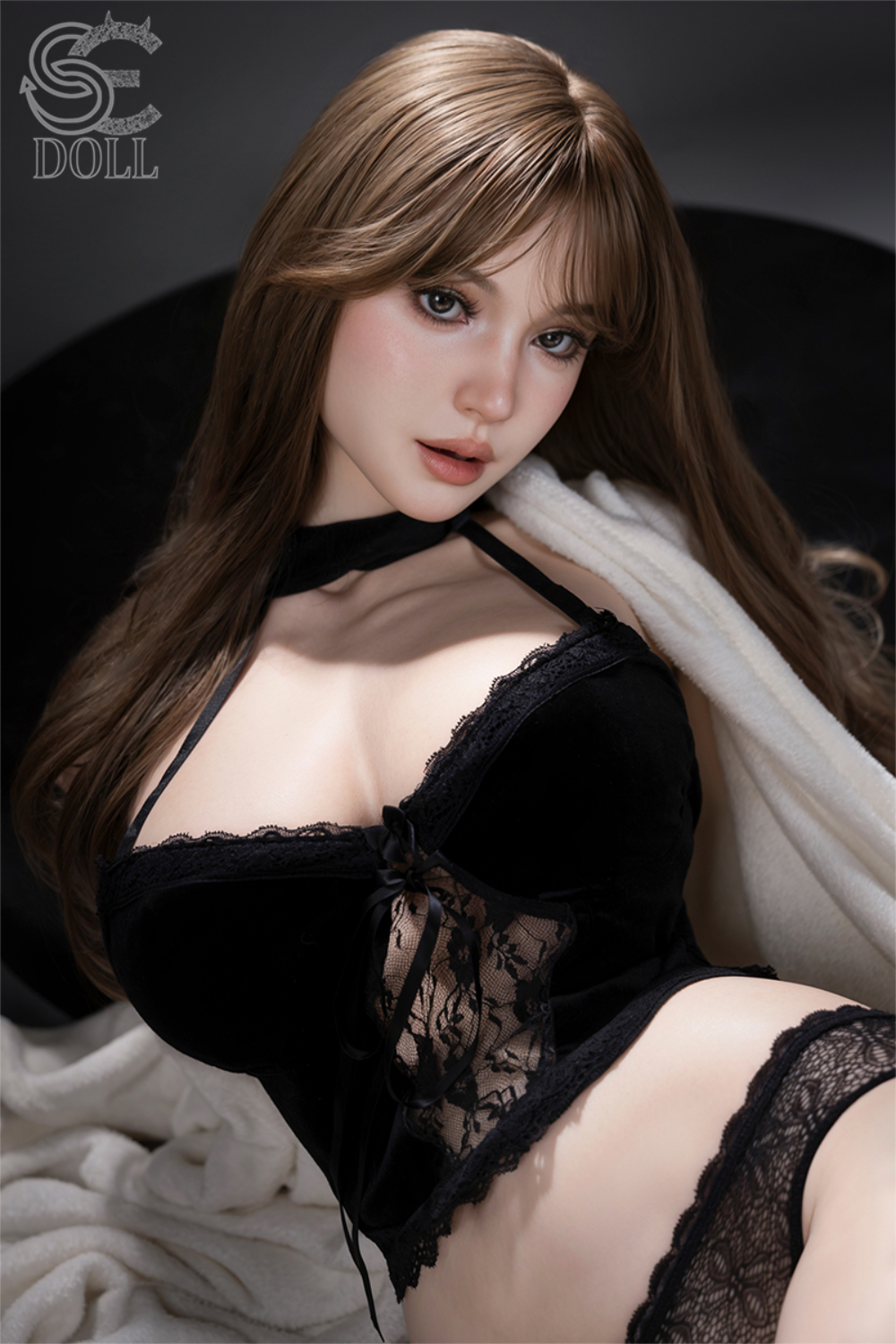 Frontal view of the SEDOLL T114cm Isla Kane.A V2 silicone torso featuring long blonde wavy hair and an intricate grey lace bodysuit with floral embroidery and silver hardware.