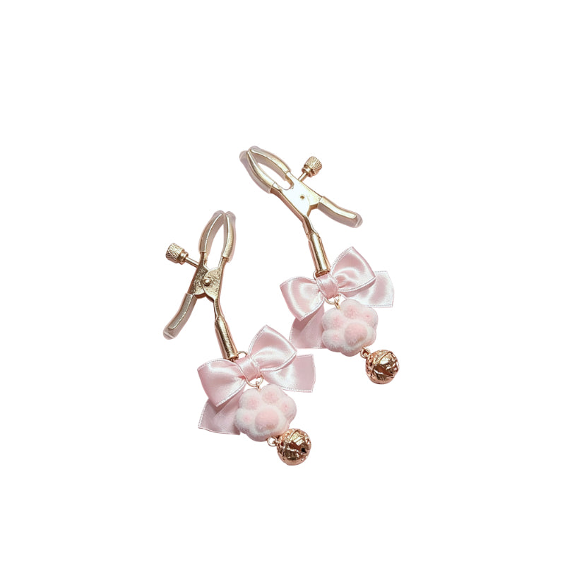 Pair of pink nipple clamps with gold accents on a white background