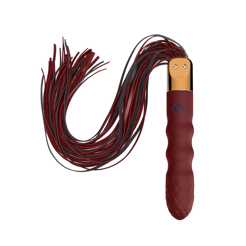 Maroon leather flogger with black tassels on a white background